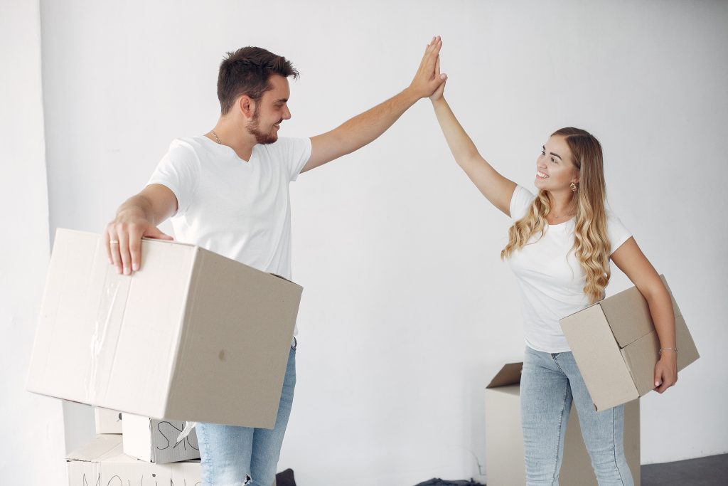 couple moving using boxes