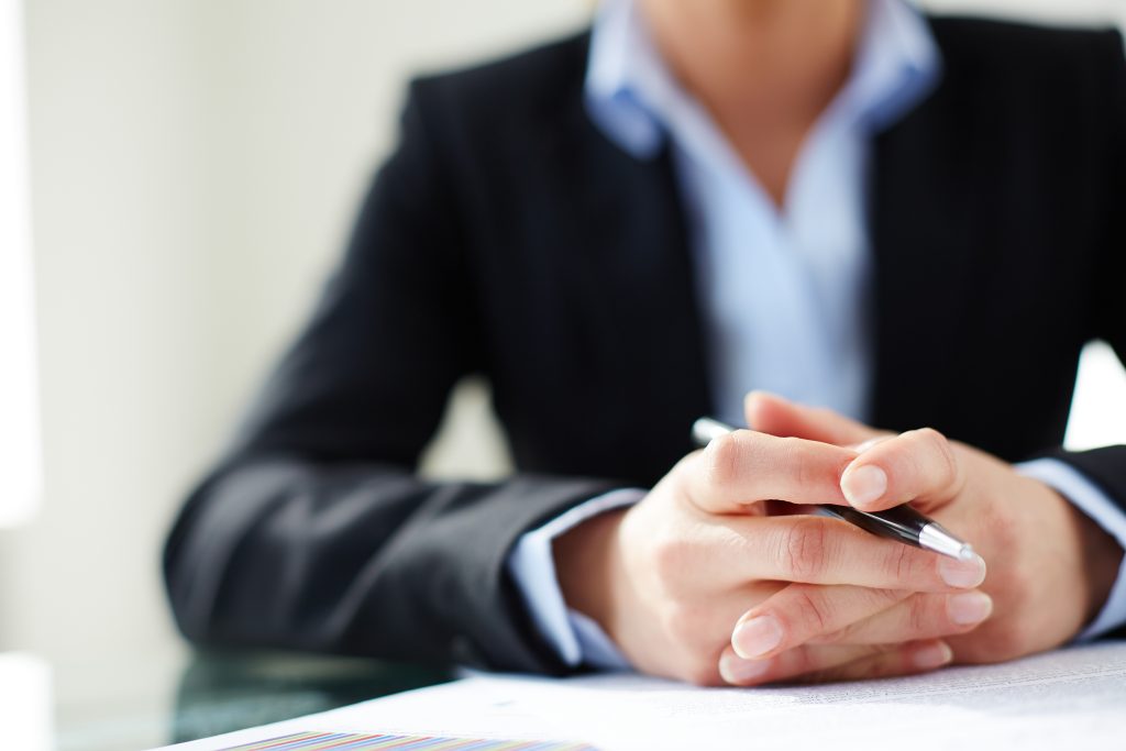 hands close up woman holding pen