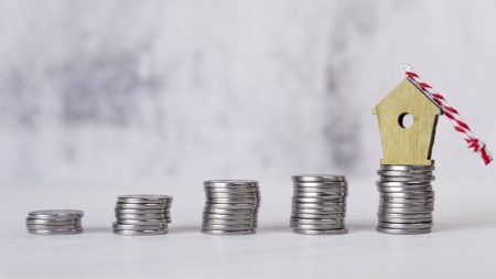 miniature birdhouse ornament increasing stacked silver coins